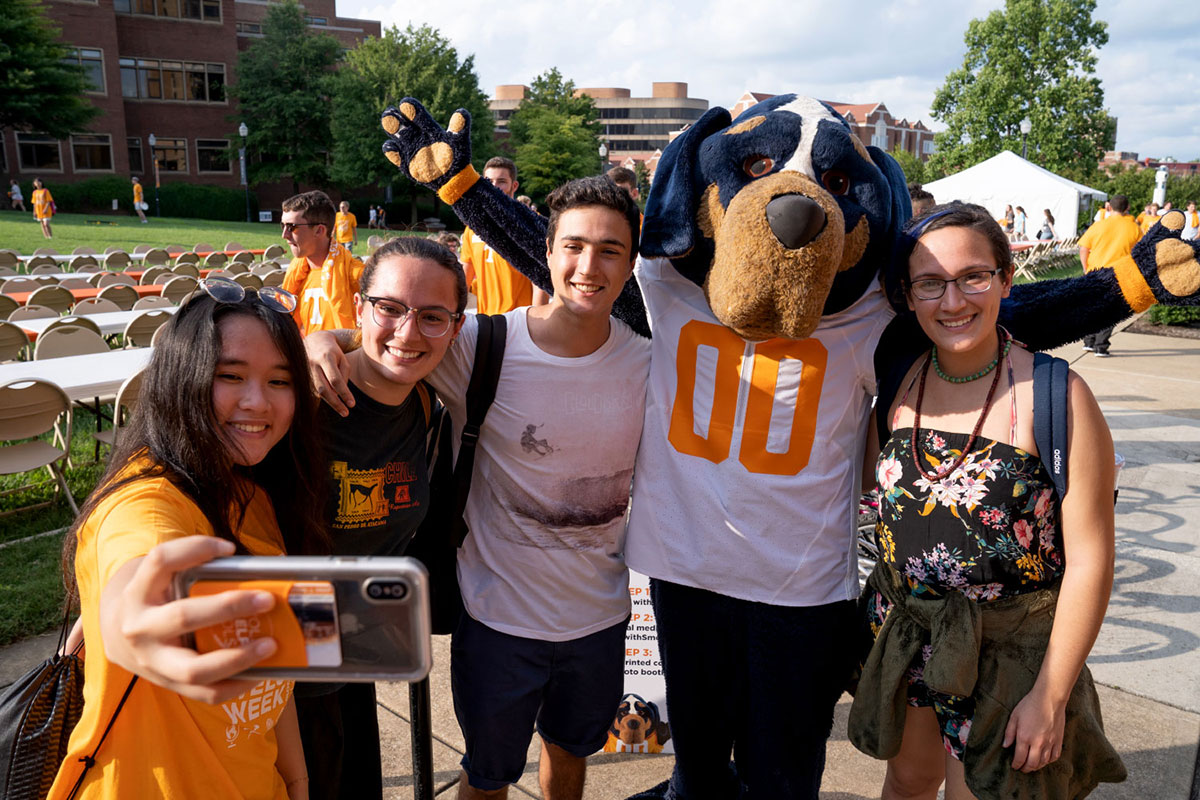 Students take a selfie with Smokey
